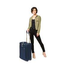 Load image into Gallery viewer, Briggs & Riley Baseline Essential 2-Wheel Carry-On - Navy
Image of female model with angled view of Navy Baseline Essential 2-Wheel Carry-On by her side
Height	      Width    Depth	       Weight
US	22 in.	14 in.	9 in. 	9.7 lbs.
EU	55.9 cm	35.6 cm	22.9 cm	4.4 kg