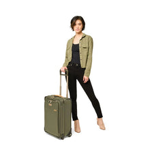 Load image into Gallery viewer, Briggs & Riley Baseline Essential 2-Wheel Carry-On - Olive
Image of Baseline Essential 2-Wheel Carry-on in Angled View with Telescoping Handle extended and shown with female model
Height	     Width	     Depth	     Weight
US	22 in.	14 in.	9 in.	        9.7 lbs.
EU	55.9 cm	35.6 cm	22.9 cm	4.4 kg
