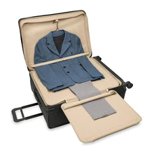 Load image into Gallery viewer, Briggs & Riley Baseline Extra Large Expandable Spinner - Black
Image of Built-in tri-fold garment folder with foam roll bar neatly holds 1-2 suits and prevents wrinkling
Height	    Width	     Depth	    Weight
US 31 in.	     22 in.	      13.8 in.     15.6 lbs.
EU 78.7 cm	55.9 cm	35.1 cm	7.1 kg