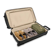 Load image into Gallery viewer, Briggs & Riley Baseline Medium 2-Wheel Duffle - Black
Image of Bottom Packing Compartment, shown packed with two pairs of shoes and standard sized toiletry kit
Height Width Depth Weight
US 27 in. 14 in. 16.5 in. 10.3 lbs.
EU 68.6 cm 35.6 cm 41.9 cm 4.7 kg
