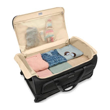 Load image into Gallery viewer, Briggs & Riley Baseline Large 2-Wheel Duffle - Black
Image of Spacious Main Packing Compartment. Also showing mesh zippered lid compartment for smaller items.
Height Width Depth Weight
US 29 in. 18 in. 16.5 in. 11.8 lbs.
EU 73.7 cm 45.7 cm 41.9 cm 5.4 kg