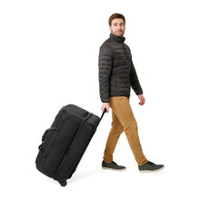 Load image into Gallery viewer, Briggs & Riley Baseline Large 2-Wheel Duffle - Black
Image of Male Model wheeling the fully packed duffle
Height Width Depth Weight
US 29 in. 18 in. 16.5 in. 11.8 lbs.
EU 73.7 cm 45.7 cm 41.9 cm 5.4 kg