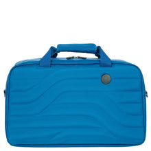 Load image into Gallery viewer, Front view of the electric blue duffle bag on a white background. The panel has a design with wave lines and a small black circle with the logo.