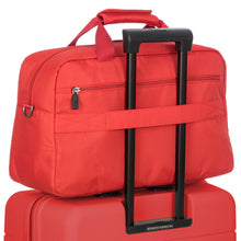 Load image into Gallery viewer, Back view of the duffle with the attachment feature on the telescopic handle of a suitcase.