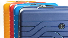 Load image into Gallery viewer, Close up to the top of four suitcases lined up one behind the other at an angle. From front to back: Ocean blue, electric blue, red, and mango yellow.