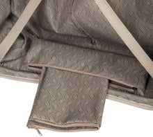 Load image into Gallery viewer, Inside view of the back panel's bottom. There is a zipper which holds a bag used to store a pair of shoes or laundry.