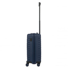 Load image into Gallery viewer, Side view of the navy blue hard shell suitcase with black accents. The telescopic handle is fully extended.