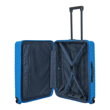 Load image into Gallery viewer, Internal view of the electric blue hard shell suitcase. The fabric lining is navy blue. The front panel's side has a zipper-closing compartment, and the back panel's side has a set of straps to hold contents.