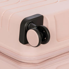 Load image into Gallery viewer, Close up a spinner wheel on the peal pink suitcase.