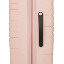 Load image into Gallery viewer, Close up to the side of the pearl pink spinner suitcase. This side features a black handle for easy grabbing.