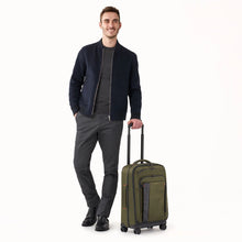 Load image into Gallery viewer, Briggs& Riley ZDX 22" Carry-On Expandable Spinner - Hunter
Shown with male model in Hunter Green
Dimensions:  22 x 14 x 9" (exp. to 11")
Weight:           7.4 lbs.