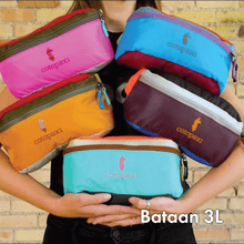 Load image into Gallery viewer, A person carrying five different Bataan hip packs.