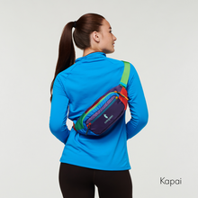 Load image into Gallery viewer, A model facing backwards while carrying the kapai bag as a sling bag.