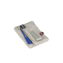 Load image into Gallery viewer, Angled view of the tan clip stash with a credit card peeking from the pocket.