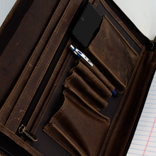 Load image into Gallery viewer, DayTrekr Distressed Leather Zip Letter Pad - Brown
Closeup View of Business Organizer on Interior. Includes file folder, zippered accessory pocket, 3-pen slots, and two gusseted pockets, ideal for smart phone and power bank.
Dimensions: 13.75 x 10.5 x 1"
