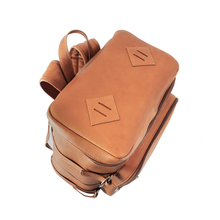 Load image into Gallery viewer, DayTrekr Top Load Leather Gear Backpack - Tan
Bird's Eye View of Top Leather Panel of Backpack.  Also showing convenient matching leather hand grip.
Dimensions:  16 x 12 x 7.5"