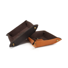 Load image into Gallery viewer, DayTrekr Leather Tray - Brown and Tan
Image of Valet Trays in both Brown and Tan. Trays fold flat for storage.
Dimensions: 6 x 6"