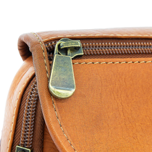 Load image into Gallery viewer, DayTrekr Leather Hip Pack - Tan
Closeup Image of contrast stitch detail, nylon coil zipper and antique brass hardware.
Dimensions: 7" H x 6.5" W x 2.5"