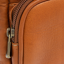 Load image into Gallery viewer, DayTrekr Leather Hip Pack - Tan
Closeup Image of Natural Full-Grain Leather, with matching nylon coil and zipper tape. Contrasted with antique brass hardware
Dimensions: 7" H x 6.5" W x 2.5"