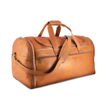 Load image into Gallery viewer, DayTrekr Leather Deluxe Duffel - Tan
Image of Front Angled View with matching leather shoulder strap
Dimensions:  22 x 12 x 12"
