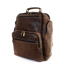 Load image into Gallery viewer, DayTrekr Distressed Leather Backpack - Brown
Image of Right-Facing side panel view with large, zippered side panel pocket. Also showing back panel laptop compartment, large main compartment and front panel business organizer compartment.
Dimensions: 15.5"W x 17"H x 8"D
