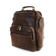 Load image into Gallery viewer, Angled front view of the brown distressed leather backpack. It features three zipper-closing compartments