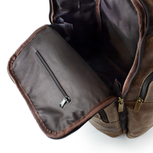 Load image into Gallery viewer, DayTrekr Distressed Leather Backpack - Brown
Image of fully lined interior. Also showing zippered accessory pocket in main packing compartment. Nylon hinges prevent contents from spilling out.
Dimensions: 15.5"W x 17"H x 8"