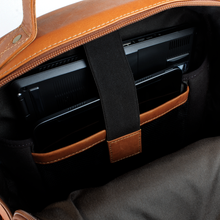 Load image into Gallery viewer, DayTrekr Leather Deluxe Organizer Backpack - Tan
Image of Back Zippered Compartment with protected sleeves designed to hold your laptop and tablet.  Includes and adjustable retainer strap to keep your appliance secured and in place.
Dimensions:  16 x 12.5 x 8.5"