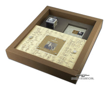 Load image into Gallery viewer, Angled interior view of the outer box with the presentation box, booklet, and ink bottle stored inside.
