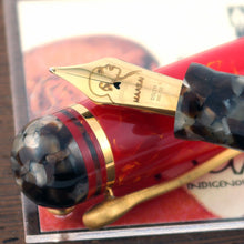 Load image into Gallery viewer, Close up to the fountain pen nib resting on the cap.