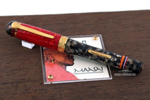 Load image into Gallery viewer, Front view of the fountain pen with the cap on. Set on top of the presentation box lid.