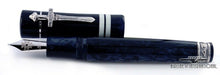Load image into Gallery viewer, The fountain pen laid horizontally. The cap is set next to it.