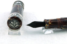 Load image into Gallery viewer, Close up to the fountain pen nib feed, with an angled top view of the cap.