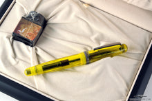 Load image into Gallery viewer, The fountain pen and sealed ink bottle arranged inside the presentation box.