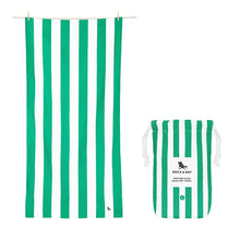 Load image into Gallery viewer, Front view of the green and white stripes towel next to the storing bag.