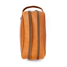 Load image into Gallery viewer, Dorado Double Pocket Shave Kit - Tan
Front Angled View of Shave Kit, showing front zippered accessory pocket and matching leather handle grip on left side.
DIMENSIONS: 10.5(L) X 5.5(H) X 5"(D)