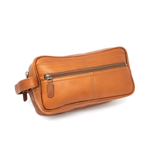 Load image into Gallery viewer, Dorado Double Pocket Shave Kit - Tan
Front Angled View of Shave Kit, showing front zippered accessory pocket and matching leather handle grip on left side.
DIMENSIONS: 10.5(L) X 5.5(H) X 5"(D)