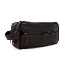 Load image into Gallery viewer, Angled front view of the brown leather toiletry bag.