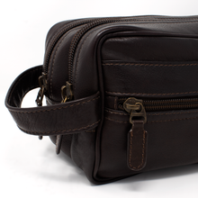 Load image into Gallery viewer, Dorado Double Pocket Shave Kit - Brown
Close up image of Left Front Panel, showing from zippered accessory pocket, two top zip main compartments, and matching leather handle grip.
DIMENSIONS: 10.5(L) X 5.5(H) X 5"(D)