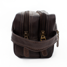 Load image into Gallery viewer, Dorado Double Pocket Shave Kit - Brown
Image of Left-Facing Side View showing two top zippered compartments and matching leather handle grip.
DIMENSIONS: 10.5(L) X 5.5(H) X 5"(D)