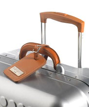 Load image into Gallery viewer, Angled close up to the top panel. The leather grip handle has a leather tag and the telescopic handle is pulled up.