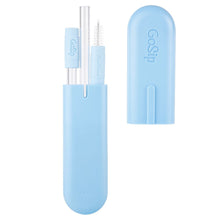 Load image into Gallery viewer, A sky blue pill-shaped container holding the draw and brush set.
