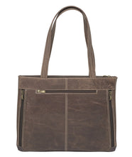 Load image into Gallery viewer, Front view of the brown leather bag with the shoulder straps pulled up.
