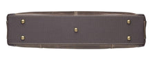 Load image into Gallery viewer, Bottom view of the brown leather bag. It features five small stub legs to stand the purse up.