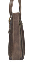 Load image into Gallery viewer, Side panel close up to the brown leather bag.