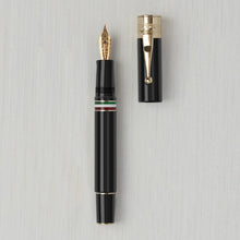Load image into Gallery viewer, Front view of the black and gold fountain pen with the cap next to it.