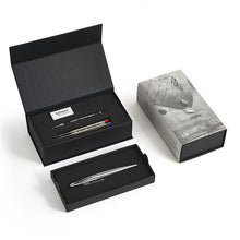 Load image into Gallery viewer, The polished chrome pen arranged with the presentation box and contents on a white background.