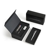 Load image into Gallery viewer, The Silver Arrow Pen arranged with the presentation box and contents on a white background.