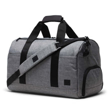 Load image into Gallery viewer, Angled front view of the duffle bag with the adjustable shoulder strap laid across.