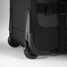 Load image into Gallery viewer, Close up to the back wheels on the black duffel.